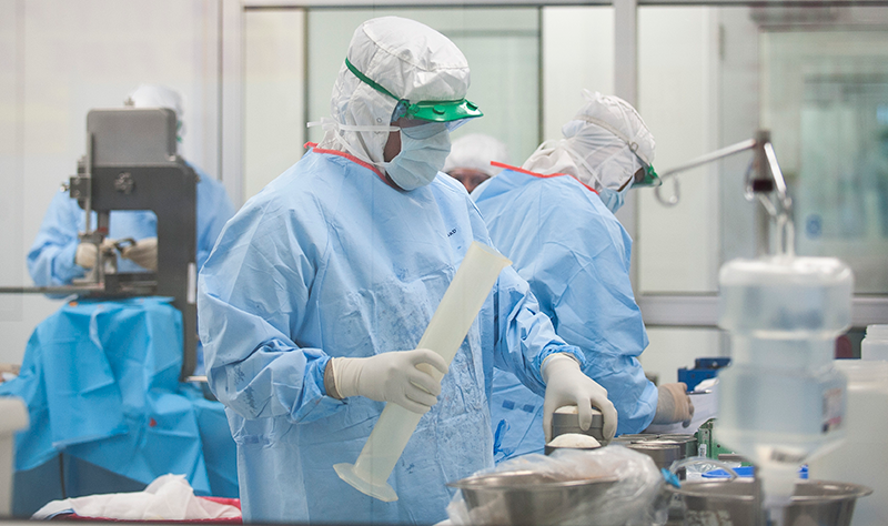 Processing Technician in full PPE on the job